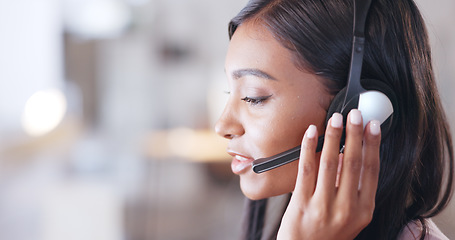 Image showing Call center agent helping client in a phone call giving great customer service. Customer support employee consulting clients online using headset. Professional friendly woman working at her desk