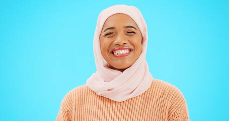 Image showing Muslim woman, laugh and happy portrait with a scarf for mockup, advertising or joke. Islamic female model with makeup and hijab laughing for comic emoji, funny meme or fashion on blue background