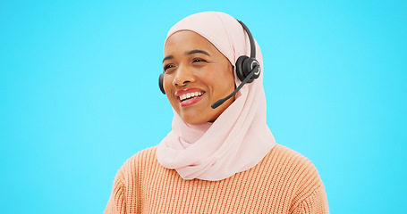 Image showing Call center, talking and woman isolated on blue background agent, consultant or muslim telemarketing support. Happy telecom, global tech support or communication of hijab person speaking in studio