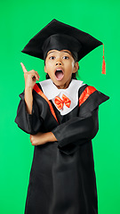 Image showing Graduation, surprise and child point on green screen for graduate, academy ceremony and award. Primary school, education and portrait of shocked girl with knowledge, achievement and success in studio