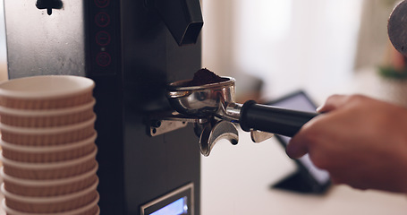 Image showing Coffee machine, barista hand and grind beans in cafe, closeup and prepare latte or espresso drink with service. Hot beverage, person working in restaurant and brewing process, premium blend caffeine