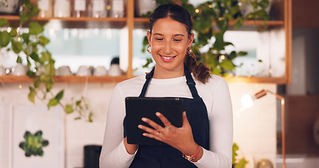 Image showing Happy woman or barista on tablet for small business owner, social media update and startup sales promotion. Waitress or retail person laugh on digital technology for coffee shop or restaurant online