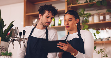 Image showing Barista team, talking with tablet in coffee shop, man and woman, discussion about work schedule or inventory check. Communication, technology with online system in cafe, working and manage sales