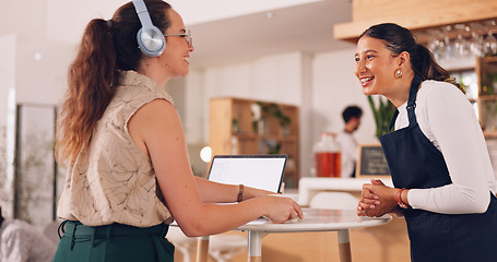 Image showing Barista helping customer, woman giving order to barista. Smiling customer getting coffee.