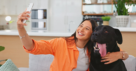 Image showing Woman, dog and selfie on living room sofa in home for care hug, touch and embrace for happy friends. Doggy mom, couch and lounge for pet, animal or social media app with smile, relax and photography