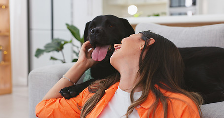 Image showing Happy woman relax with her dog at home for mental health, wellness or emotional support, love and care. Young person sitting on living room floor and pet, animal or Labrador retriever kiss and stroke