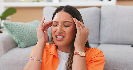 Image showing Headache, sick woman and pain in home of stress, dizzy brain or mental health crisis in house. Sad female with migraine, tension and anxiety of burnout, medical problems and frustrated face in lounge