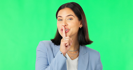 Image showing Green screen, secret and wink face of happy woman, privacy and finger on lips in studio. Portrait of female model, silence and smile for business surprise announcement, whisper emoji and mystery deal