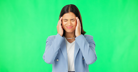 Image showing Business woman, headache and pain on green screen, studio and stress of dizzy mind, mental health and brain fog. Frustrated female worker, migraine and anxiety of burnout, problems and fatigue face