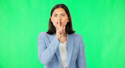 Image showing Finger, lips and face of serious woman on green screen, studio or background of privacy. Business portrait, angry female worker and silence of noise, shush or hands on mouth in secret, quiet or emoji