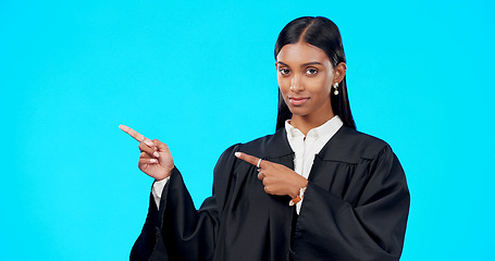 Image showing Portrait mockup or woman lawyer pointing in studio for product placement, advertising or marketing. Mockup space, legal job or Indian girl attorney showing promotion offer or deal on blue background