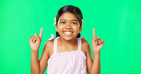 Image showing Face, pointing and black girl with motivation, green screen and inspiration with joy, happiness and space. Portrait, African American female child or young person with gesture for direction or choice