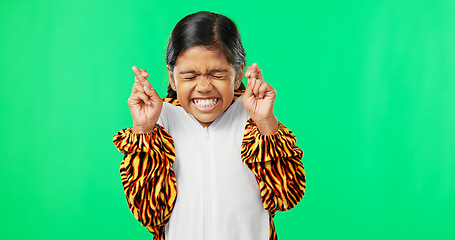 Image showing Hope, excited and a girl with a gesture on a green screen isolated on a studio background. Wish, hopeful and a child with excitement, hoping and making a wish with fingers crossed on a backdrop