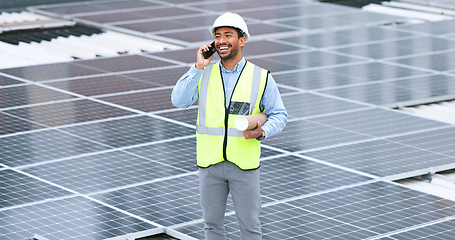 Image showing Ambitious, happy and confident solar power installer, engineer and electrician talking on a phone while discussing blueprint plans for construction, building and maintenance of renewable energy