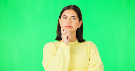 Image showing Mind, thinking and decision with a woman on a green screen background in studio to consider an option. Idea, face and contemplating with an attractive young female looking thoughtful on chromakey