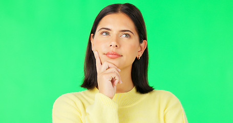 Image showing Face, thinking and consider with a woman on a green screen background in studio to decide her options. Idea, mind and contemplating with an attractive young female looking thoughtful on chromakey