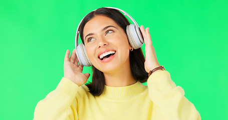 Image showing Face, green screen and woman with headphones, dance and music streaming against a studio background. Portrait, female and person with headset, listening to audio and sounds for movement and smile