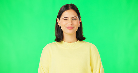 Image showing Happy, woman and face wink on green screen, studio and color background. Portrait, female model and winking with smile of cool girl, fun mood and joyful personality in happiness, emoji and flirting