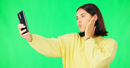 Image showing Happy woman, face and selfie on green screen with peace sign and facial expressions against studio background. Silly or goofy female model smiling for photo, emoji or memory with smartphone on mockup