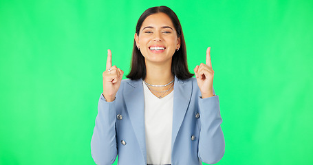 Image showing Green screen, business and face of happy woman pointing up to news on mockup color background. Portrait of female employee advertising promotion, product placement or presentation of deal coming soon