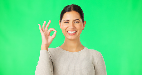 Image showing Okay hands, face and woman smile on green screen, background and studio in agreement of support. Portrait of female model, happy and ok for success, yes and winner of perfect emoji, thank you or hope