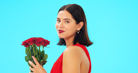 Image showing Face, woman and rose bouquet in studio on blue background with fresh, floral or romantic gesture on mockup. Portrait, flower and girl with gift, present and romance, valentines or offering isolated