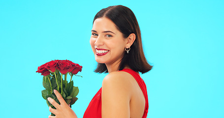 Image showing Face, woman and rose bouquet in studio on blue background with fresh, floral or romantic gesture on mockup. Portrait, flower and girl with gift, present and romance, valentines or offering isolated