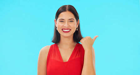 Image showing Woman face, pointing and promotion with beauty and smile showing mockup for advertisement. Portrait, isolated and studio background with a happy young female point to show mock up announcement