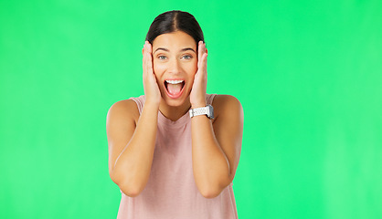 Image showing Shock, surprise and face of woman on green screen for good news, announcement and discount in studio. Excited, happy and portrait of isolated girl smile with shocked, wow and omg facial expression