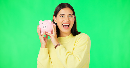 Image showing Happy woman, money and savings on green screen for investment, budget or finance against studio background. Portrait of excited female smile holding piggybank for coin, profit or investing on mockup