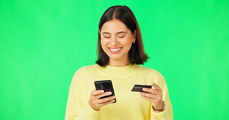 Image showing Happy woman, phone and credit card on green screen for online shopping, ecommerce or purchase against studio background. Female shopper smile for smartphone transaction or internet banking on mockup