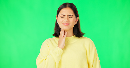 Image showing Green screen, woman and pain in throat, flu infection and suffering from cold virus in studio. Sick female model, allergies and massage neck for health risk, covid and itchy voice of thyroid problem