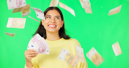 Image showing Happy woman, cash and money rain on green screen for winning, prize or lottery against a studio background. Portrait of female winner with smile for financial freedom, wealth or investment on mockup