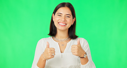 Image showing Happy woman, hands and thumbs up on green screen for agreement, winning or success against a studio background. Portrait of female with smile showing thumb emoji, yes sign or like on chromakey mockup