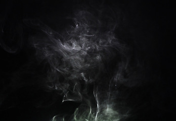 Image showing Grey smoke puff, white background and studio with no people with fog in the air. Smoking, smog swirl and isolated with smoker art from cigarette or pollution with graphic space for incense creativity