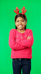 Image showing Christmas, smile and happy with girl in green screen studio for positive, celebration and festive. Present, cheerful and vacation with portrait of child on background for season, holiday or happiness