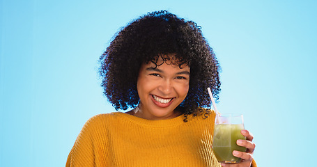 Image showing Green juice, black woman and healthy fruit smoothie of a person drinking weight loss drink. Glass, studio background and female sip a vegetable, nutrition and detox shake for health and wellness