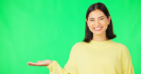 Image showing Happy woman, hand and green screen for product placement, advertising or marketing against studio background. Portrait of female face with smile showing advertisement or sale on copy space mockup