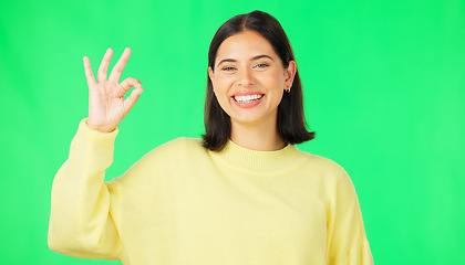 Image showing Ok, green screen and portrait of woman doing a perfect sign or hand gesture isolated in a studio background. Excited, happy and female showing approval, accept and agreement signal for perfection