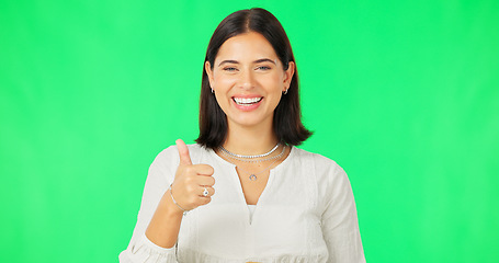 Image showing Happy woman, hand and thumbs up on green screen for agreement, winning or success against a studio background. Portrait of female with smile showing thumb emoji, yes sign or like on chromakey mockup