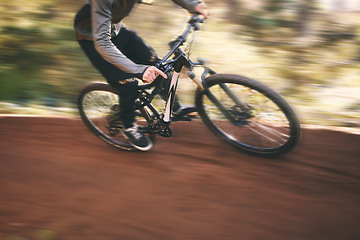 Image showing Bike, cycling, and fast with man in nature for training, extreme sports and motion blur. Workout, race and speed with cyclist in forest park for performance, fitness challenge and adventure