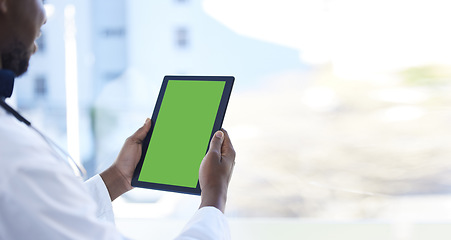 Image showing Doctor, man and hands with green screen on tablet for Telehealth, healthcare or life insurance at the hospital. Hand of male medical professional holding technology with mockup or copy space display