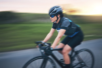 Image showing Motion blur, fitness and cycling woman on road for training, competition and nature championship. Workout, sports and triathlon with female cyclist on bike for freedom, exercise and fast speed