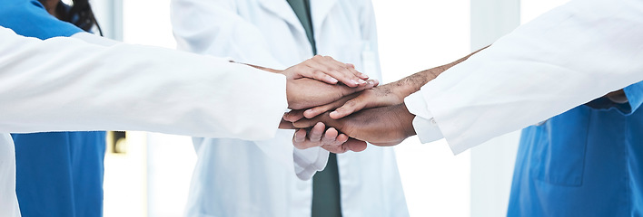 Image showing Hand stack, group and doctors with teamwork, motivation and support for healthcare services at clinic. Men, women and medic team building with hands, solidarity and together at hospital for wellness