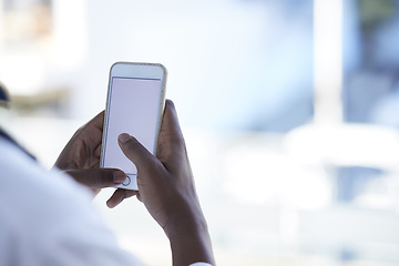 Image showing Doctor, man and hands with phone mockup for telehealth, healthcare or life insurance at hospital. Hand of male medical professional holding smartphone and copy space display for advertising at clinic