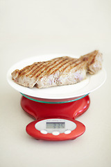 Image showing Weighing dinner, scale and measuring beef for calories, nutritional value and protein on a plate. Healthy meat, measurement and a steak for dietary portion for a balanced diet on a table for lunch