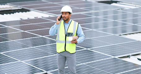 Image showing Ambitious, happy and confident solar power installer, engineer and electrician talking on a phone while discussing blueprint plans for construction, building and maintenance of renewable energy