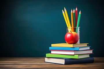 Image showing Stack of books with pencils