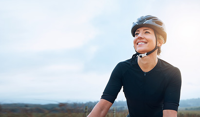 Image showing Smile, fitness and woman thinking while cycling in countryside, happy and relax in nature. Contemplate, sports and lady cyclist training in Mexico for travel, vacation or cardio, routine or workout