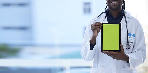 Image showing Doctor, happy man and hands with green screen on tablet in telehealth, healthcare or life insurance at hospital. Hand of male medical professional holding technology with mockup or copy space display